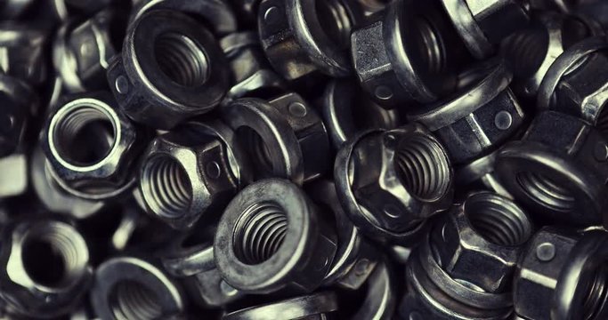 Background of the steel nuts on the bolts in close view.