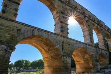 Fotobehang Pont du Gard Aqueduct Pont du Gard with sunburst, southern France