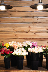 Fototapeta na wymiar Studio decor and sale of flowers for the holidays. Bouquets of roses for sale.