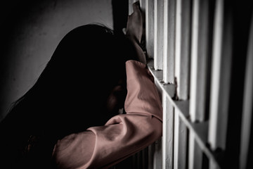 Hands of women desperate to catch the iron prison,prisoner concept,thailand people,Hope to be free.