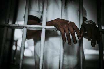 Hands of men desperate to catch the iron prison,prisoner concept,thailand people,Hope to be free.