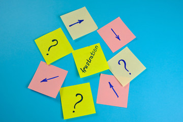  Many colored  office stickers on a blue background and one separately in the center . Mock-up