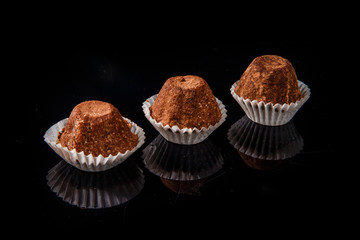 row of three healthy useful organic handmade chocolate candies