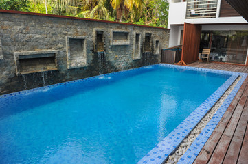 Swimming pool of hotel.Beautiful luxury outdoor swimming pool with stair in hotel and resort for holiday travel and vacation
