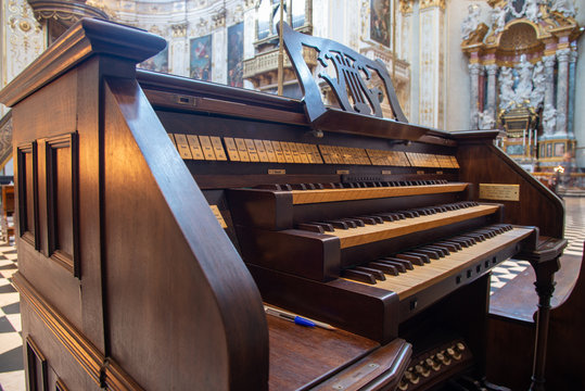 Ancient organ inside a church. The pump organ, pipe organ, harmonium or melodeon is a type of free-form organ that generates sound when air flows past a vibrating piece of thin metal into a frame.