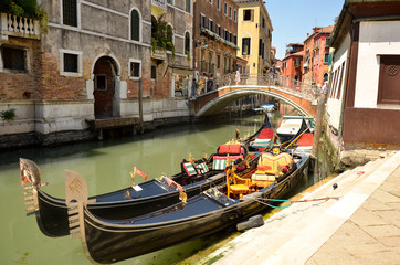 Fototapeta na wymiar Gondola service tourist people travel around Venice in Italy. Gondolas in Venice.