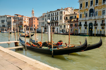 Fototapeta na wymiar Gondolas on Grand canal. Gondola in Venice. Venice, Italy