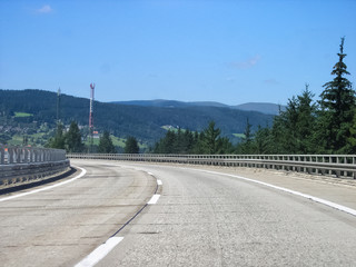 On the road, Austrian alps. Highway in Austria with a mountain view. 