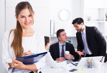 Business woman writing down tasks