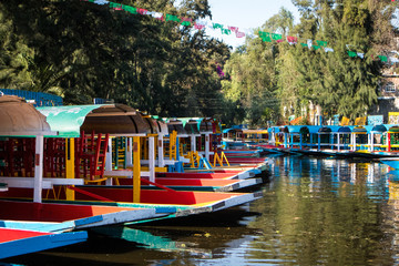 Fototapeta na wymiar Boats on Canals of Xochimilco in Mexico City