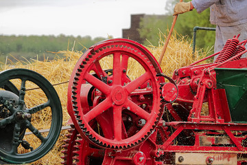 Wheels and gears on an old baling machine