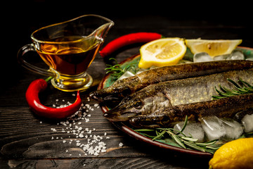 European pike, vegetable, superfood on black concrete background. Flat lay. copy space