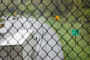 Highway from above through fence
