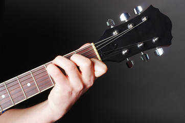 Guitarist playing guitar. Close-up