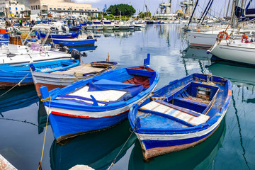 Fototapeta na wymiar Fishing boats in the harbor of Palermo,shallow depth of field