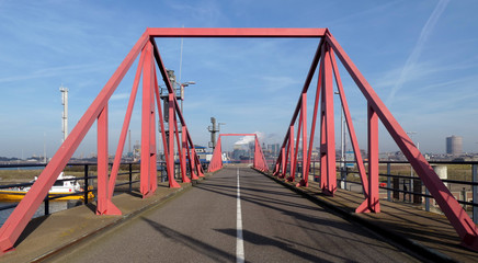 Fototapeta na wymiar Bridge made of red steel pipes