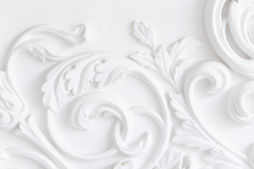 Beautiful ornate white decorative plaster moldings in studio - obrazy, fototapety, plakaty