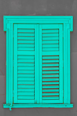 Windows with green wooden shutters