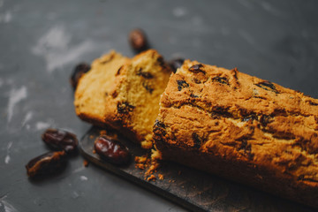 Cornbread with dates on a gray background