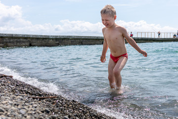 Fototapeta premium Boy swimming in the sea