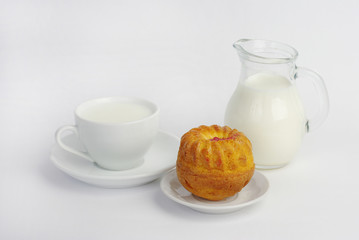   Cup of milk and cupcake