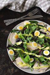 Healthy salad with quail eggs, salad mix and chicken breast. Keto diet. Paleo. Pegan