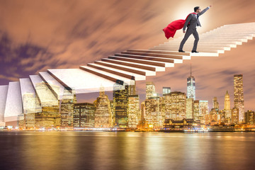 Superhero businessman climbing career ladder
