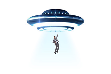 Flying saucer abducting young businessman 