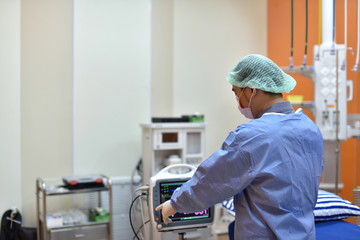 The doctor is preparing for surgery with modern equipment ready for cosmetic surgery.