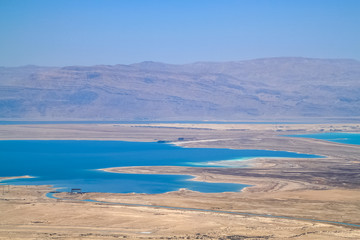 Stunning view of salt deposits and turquoise water of the Dead Sea and Judean Desert in Israel