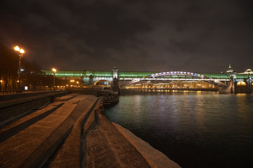 Fototapeta premium Park Gorkogo in Moscow (Gorky park) at night winter time. Andreevsky pedestrian bridge image.