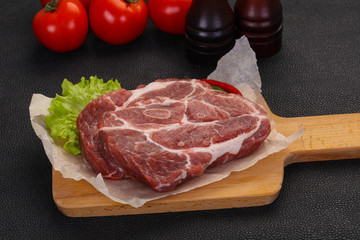Raw pork neck steak
