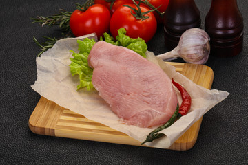 Raw Turkey steak served rosemary