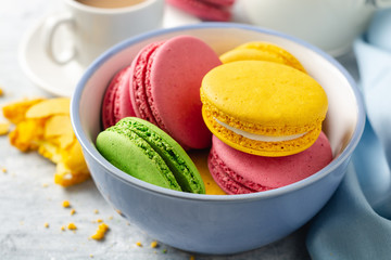 Colorful french macarons on concrete background. Selective focus.