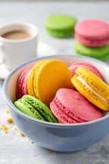 Colorful french macarons on concrete background. Selective focus.