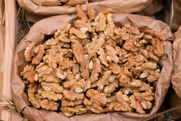 Paper bag with walnuts close-up