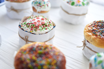 Easter cakes on a white wooden background