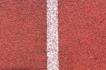 Running track sports texture. Running track rubber cover. Tartan track material is the trademarked...