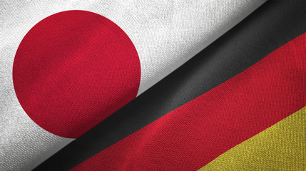Japan and Germany two flags textile cloth, fabric texture