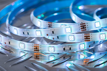 RGB LED light strip in front of colorful bokeh metal diamond plate background