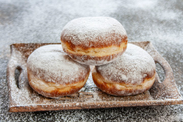 Donuts on a wooden tray