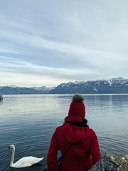 Fototapeta premium hipster girl alpine lake with swan big mountains
