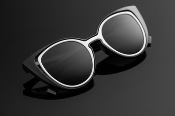 Black sunglasses with a white insert.