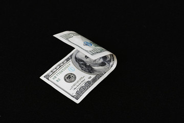 100 USD banknote, black background