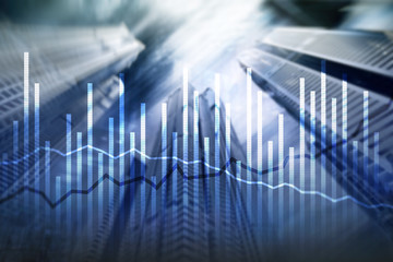 Double exposure Economics growth diagrams on blurred background. Business and investment concept.