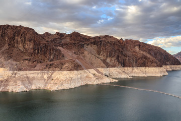 Hoover Dam is a concrete arch-gravity dam in the Black Canyon of the Colorado River, on the border between the U.S. states of Nevada and Arizona. It is Hydroelectric power station