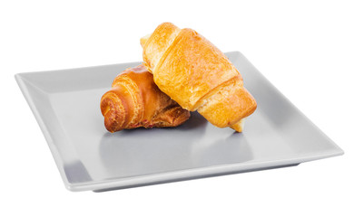 two croissants on a square grey plate