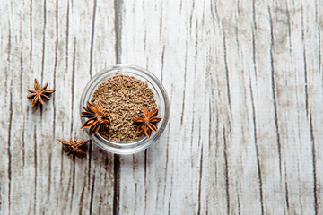 Top view Grain anise and stars of anise on a wooden table. Anise put on the table. The concept of using seasonings for dishes. Eating spiced dishes.