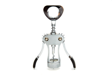 A nice silver wine corkscrew on a white, isolated background. The corkscrew lies on the table. The...