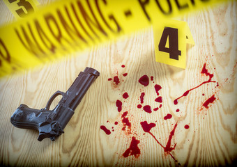 scene of crime, Gun next to drops of blood on the ground, conceptual image, horizontal composition